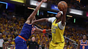 May 27, 2025; Indianapolis, Indiana, USA; Indiana Pacers center Myles Turner (33) drives to the hoop past New York Knicks center Karl-Anthony Towns (32) during the second quarter of game four of the eastern conference finals for the 2025 NBA Playoffs at Gainbridge Fieldhouse. Mandatory Credit: Trevor Ruszkowski-Imagn Images