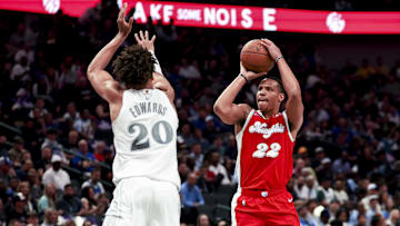 Mar 7, 2025; Dallas, Texas, USA; Memphis Grizzlies guard Desmond Bane (22) shoots over Dallas Mavericks forward Kessler Edwards (20) during the first half at American Airlines Center. Mandatory Credit: Kevin Jairaj-Imagn Images
