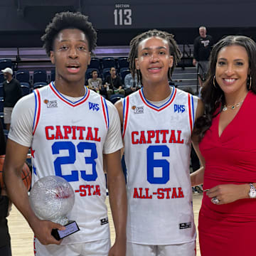 (From left) Rodney Ward and Cam Ward pose for a photo with Jordan Scott and his mom Christy Winters-Scott, after The Capital Classic High School All-Star Basketball Game at CareFirst Arena in Washington, DC. 