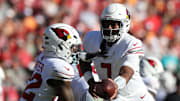 Nov 30, 2025; Tampa, Florida, USA; Arizona Cardinals quarterback Jacoby Brissett (7) hands off to running back Michael Carter (22) during the second half against the Tampa Bay Buccaneers at Raymond James Stadium. Mandatory Credit: Nathan Ray Seebeck-Imagn Images