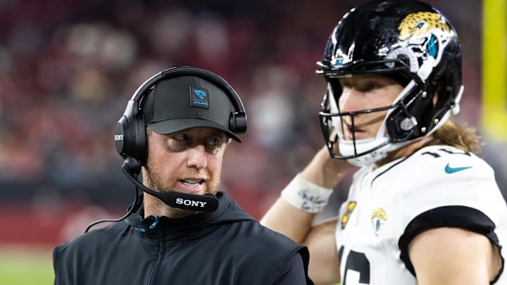 Nov 23, 2025; Glendale, Arizona, USA; Jacksonville Jaguars head coach Liam Coen with quarterback Trevor Lawrence (16) against the Arizona Cardinals at State Farm Stadium. Mandatory Credit: Mark J. Rebilas-Imagn Images