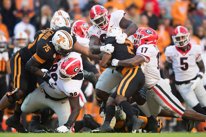 Tennessee running back Jabari Small is tackled during an SEC football homecoming game between the Tennessee Volunteers a