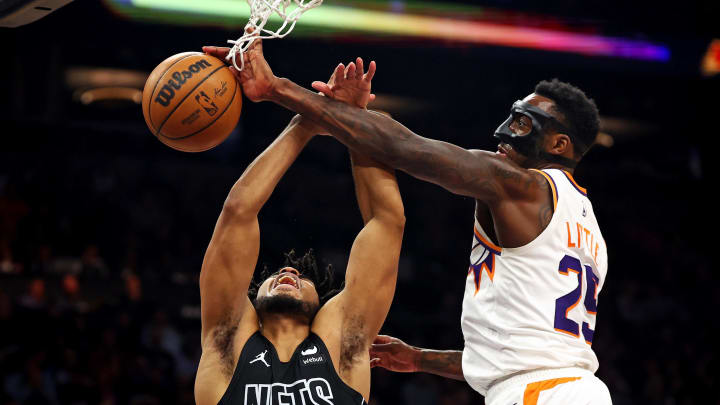 Dec 13, 2023; Phoenix, Arizona, USA; Phoenix Suns forward Nassir Little (25) blocks the shot of Brooklyn Nets guard Cam Thomas (24) during the second quarter at Footprint Center. Mandatory Credit: Mark J. Rebilas-USA TODAY Sports