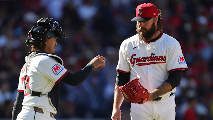 Cleveland Guardians relief pitcher Hunter Gaddis (33) meets with catcher Bo Naylor (23) during Game 2 of the American League wild card series at Progressive Field, Oct. 1, 2025, in Cleveland, Ohio.