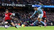 Phil Foden (left) decided the derby on Sunday