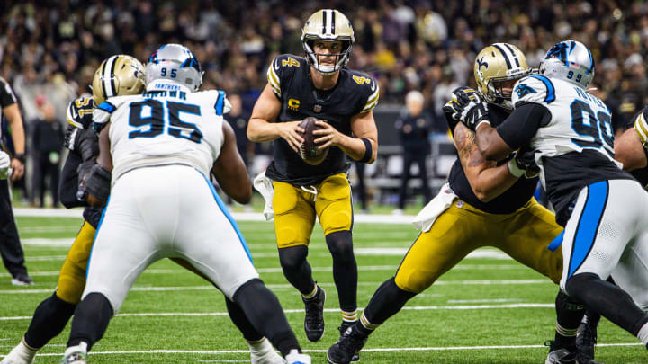 New Orleans Saints quarterback Derek Carr (4) looks to pass against the Carolina Panthers