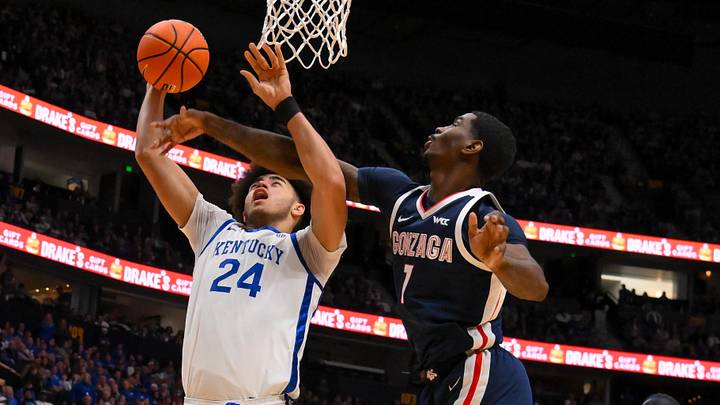 Dec 5, 2025; Nashville, TN, USA;  Gonzaga Bulldogs guard Tyon Grant-Foster (7) blocks the shot of  Kentucky Wildcats center Malachi Moreno (24) during the first half at Bridgestone Arena. Mandatory Credit: Steve Roberts-Imagn Images