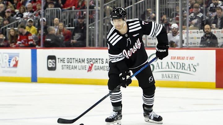 Dec 14, 2024; Newark, New Jersey, USA; New Jersey Devils defenseman Dougie Hamilton (7) skates with the puck against the Chicago Blackhawks during the second period at Prudential Center. Mandatory Credit: John Jones-Imagn Images