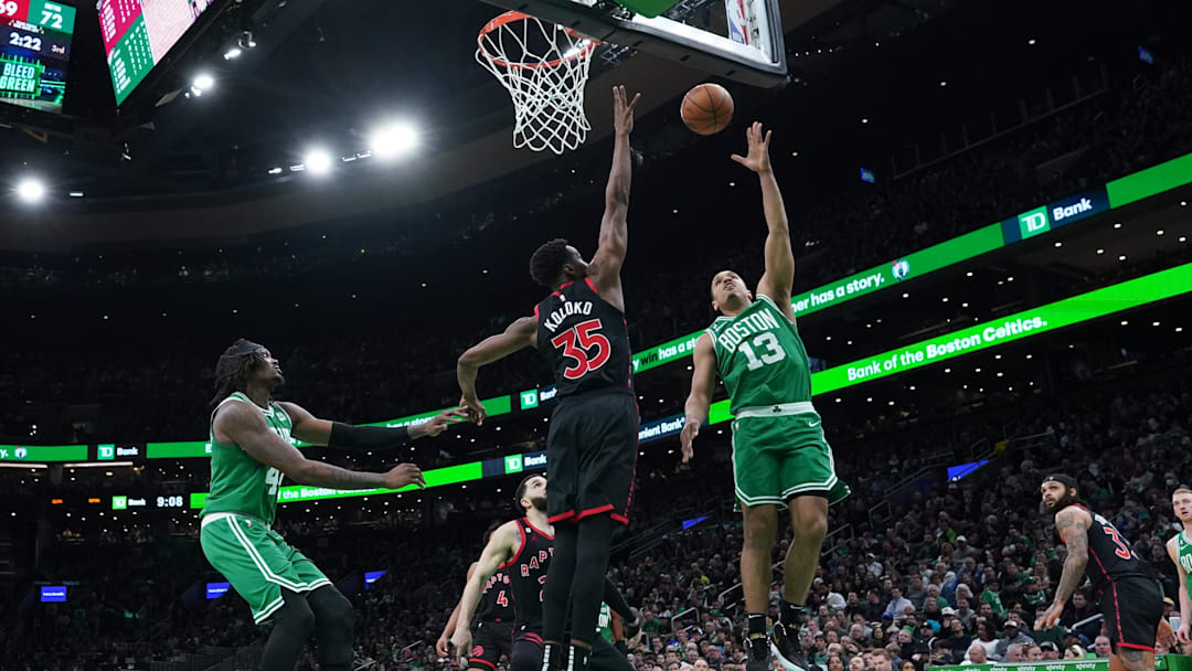 Apr 5, 2023; Boston, Massachusetts, USA; Boston Celtics guard Malcolm Brogdon (13) shoots against Toronto Raptors center Christian Koloko (35) in the second half at TD Garden. Mandatory Credit: David Butler II-Imagn Images