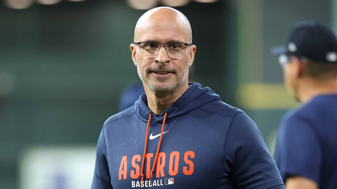 Sep 30, 2026; Houston, Texas, USA;  Houston Astros manager Joe Espada (21) looks on during batting practice prior to game two of the Wildcard round against the Chicago White Sox in the 2026 MLB Playoffs at Daikin Park.  Mandatory Credit: Troy Taormina-Imagn Images