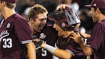 Jun 19, 2024; Omaha, NE, USA; Texas A&M Aggies designated hitter Hayden Schott (5) and catcher Jackson Appel (20) celebrate after defeating the Florida Gators to make it to the championship at Charles Schwab Field Omaha. Mandatory Credit: Dylan Widger-USA TODAY Sports