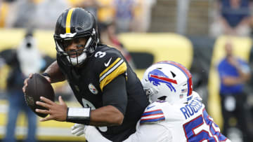 Aug 17, 2024; Pittsburgh, Pennsylvania, USA;  Buffalo Bills defensive end Greg Rousseau (50) sacks Pittsburgh Steelers quarterback Russell Wilson (3) during the first quarter at Acrisure Stadium. Mandatory Credit: Charles LeClaire-USA TODAY Sports