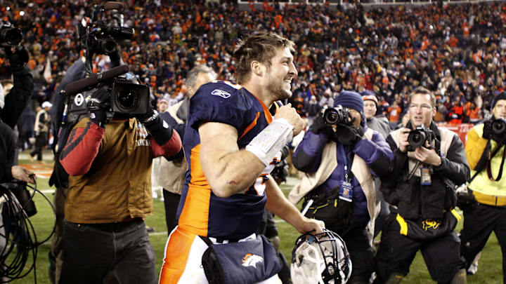 Jan 8 2012; Denver, CO, USA;  Denver Broncos quarterback Tim Tebow (15) reacts after the win in overtime against the Pittsburgh Steelers of the 2011 AFC wild card playoff game at Sports Authority Field. The Broncos defeated the Steelers 23-29 in overtime. Mandatory Credit: Ron Chenoy-Imagn Images