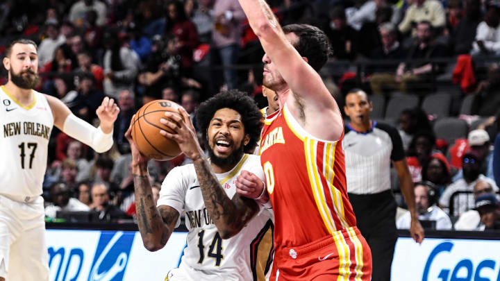 Oct 14, 2022; Birmingham, Alabama, USA; New Orleans Pelicans forward Brandon Ingram (14) is defended by the Atlanta Hawks in the third quarter at Legacy Arena at BJCC. Mandatory Credit: Larry Robinson-USA TODAY Sports