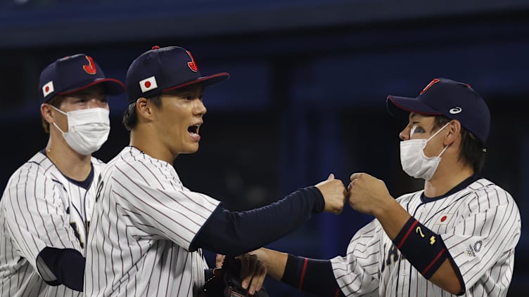 Aug 4, 2021; Yokohama, Japan; Team Japan pitcher Yoshinobu Yamamoto (17) celebrates after retiring