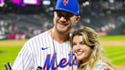 July 12, 2021; Denver, CO, USA; New York Mets first baseman Pete Alonso poses for photographs with wife Haley Walsh and the winners trophy following his victory in the 2021 MLB Home Run Derby.