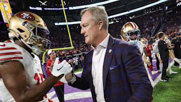 San Francisco 49ers wide receiver Jauan Jennings (L) and general manager John Lynch (R)