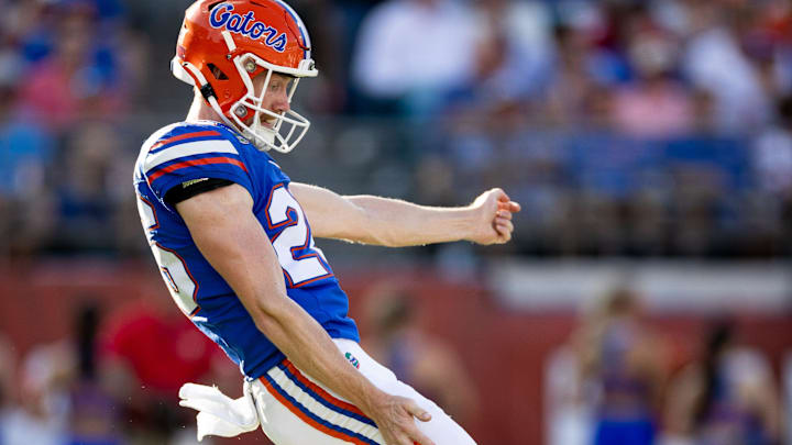 Florida Gators punter Jeremy Crawshaw (26) punts the ball during the first half against the Georgia Bulldogs at Everbank Stadium in Jacksonville, FL on Saturday, October 28, 2023. [Matt Pendleton/Gainesville Sun]