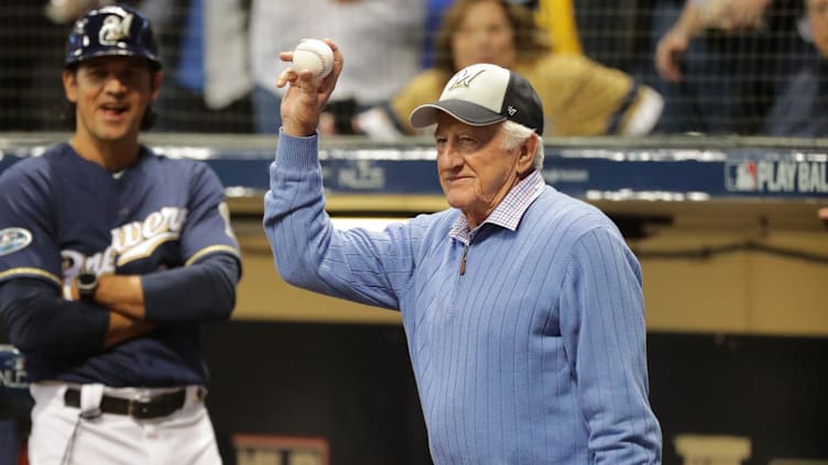 Legendary Brewers radio broadcaster Bob Uecker salutes the crowd after throwing out the first pitch