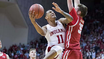 Indiana Hoosiers guard Devonte Green (11) shoots the ball while Wisconsin Badgers forward Nate Reuvers (35) defends in the first half at Simon Skjodt Assembly Hall.