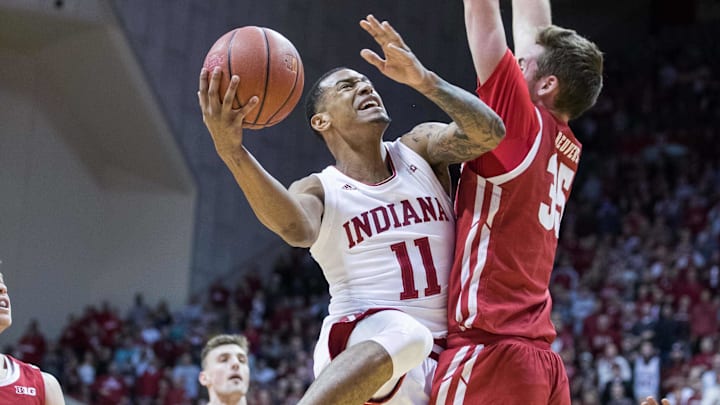 Indiana Hoosiers guard Devonte Green (11) shoots the ball while Wisconsin Badgers forward Nate Reuvers (35) defends in the first half at Simon Skjodt Assembly Hall. Indiana Hoosiers guard Devonte Green (11) shoots the ball while Wisconsin Badgers forward Nate Reuvers (35) defends in the first half at Simon Skjodt Assembly Hall.