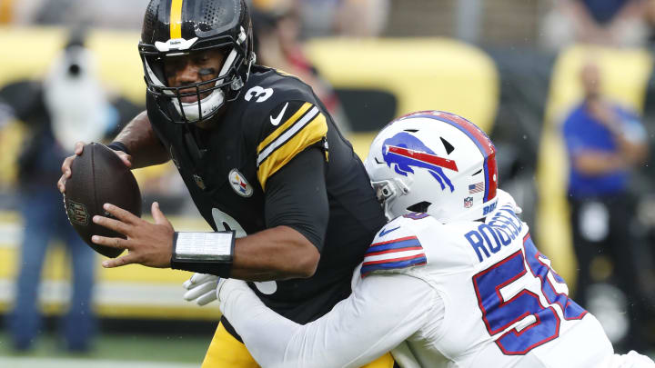 Aug 17, 2024; Pittsburgh, Pennsylvania, USA;  Buffalo Bills defensive end Greg Rousseau (50) sacks Pittsburgh Steelers quarterback Russell Wilson (3) during the first quarter at Acrisure Stadium. Mandatory Credit: Charles LeClaire-USA TODAY Sports