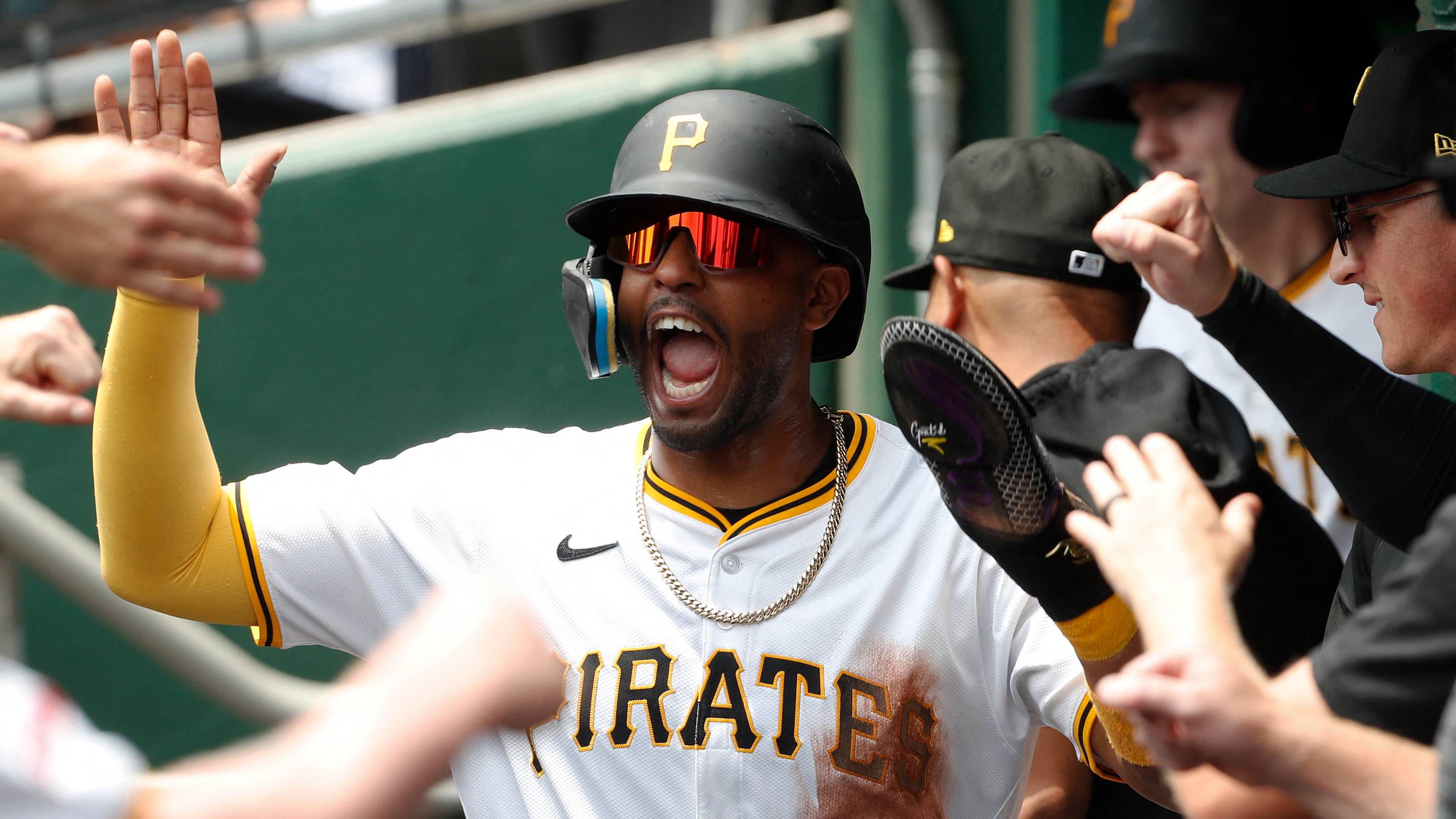 Jul 24, 2024; Pittsburgh, Pennsylvania, USA; Pittsburgh Pirates left fielder Joshua Palacios (77) celebrates in the dugout after scoring a run against the St. Louis Cardinals during the second inning at PNC Park. Mandatory Credit: Charles LeClaire-USA TODAY Sports