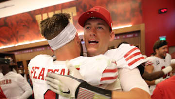 San Francisco 49ers wide receiver Ricky Pearsall (L) and quarterback Mac Jones (R)