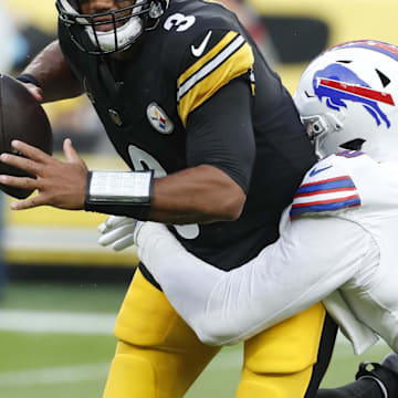 Aug 17, 2024; Pittsburgh, PA;  Buffalo Bills defensive end Greg Rousseau (50) sacks Pittsburgh Steelers quarterback Russell Wilson (3) during the first quarter at Acrisure Stadium. 