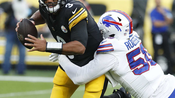 Aug 17, 2024; Pittsburgh, PA;  Buffalo Bills defensive end Greg Rousseau (50) sacks Pittsburgh Steelers quarterback Russell Wilson (3) during the first quarter at Acrisure Stadium. 