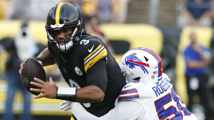 Aug 17, 2024; Pittsburgh, Pennsylvania, USA;  Buffalo Bills defensive end Greg Rousseau (50) sacks Pittsburgh Steelers quarterback Russell Wilson (3) during the first quarter at Acrisure Stadium. Mandatory Credit: Charles LeClaire-USA TODAY Sports