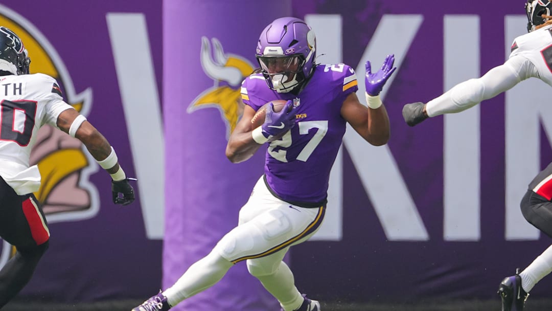 Aug 9, 2025; Minneapolis, Minnesota, USA; Minnesota Vikings running back Jordan Mason (27) runs with the ball against the Houston Texans in the first quarter at U.S. Bank Stadium. Mandatory Credit: Brad Rempel-Imagn Images