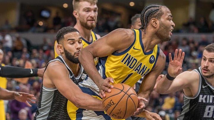 Dec 20, 2019; Indianapolis, IN, USA; Indiana Pacers forward T.J. Warren (1) is fouled by Sacramento Kings guard Corey Joseph (9) in the second half at Bankers Life Fieldhouse. Mandatory Credit: Trevor Ruszkowski-Imagn Images