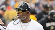 Nov 8, 2025; Morgantown, West Virginia, USA; Colorado Buffaloes head coach Deion Sanders walks along the sidelines late in the fourth quarter against the West Virginia Mountaineers at Milan Puskar Stadium. Mandatory Credit: Ben Queen-Imagn Images