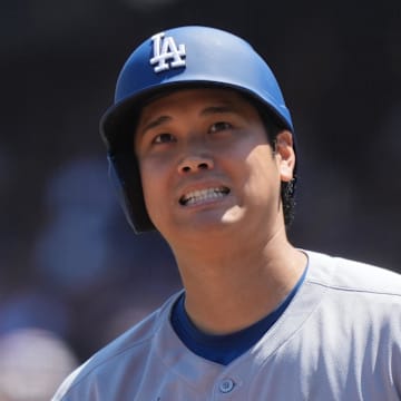Los Angeles Dodgers starting pitcher Shohei Ohtani reacts to a hit.