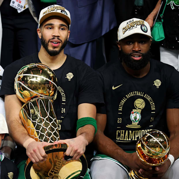 Boston Celtics forward Jayson Tatum (0) and guard Jaylen Brown (7) celebrates with the Larry O’Brian Trophy in 2023-24.