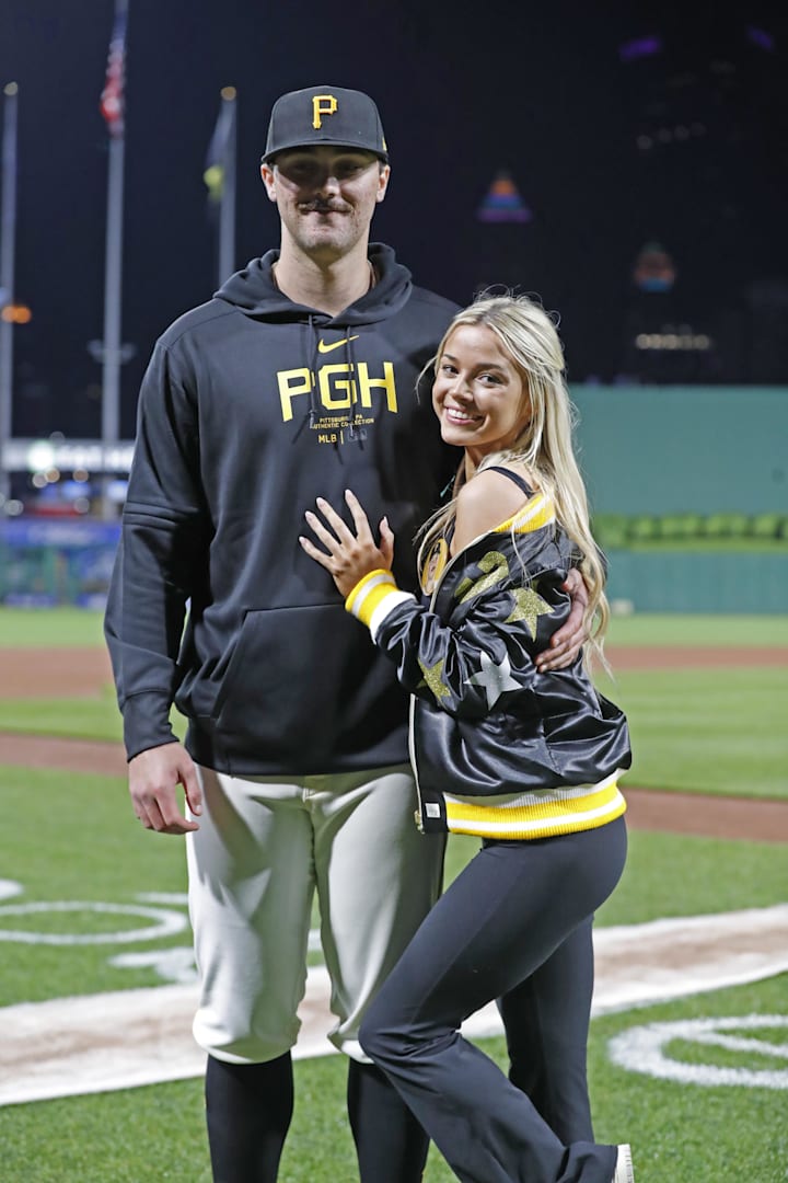 Pittsburgh Pirates starting pitcher Paul Skenes poses with his girlfriend Livvy Dunne after making his major league debut. 