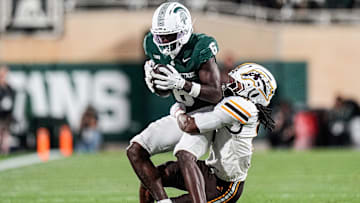 Michigan State wide receiver Nick Marsh (6) makes a catch against Western Michigan cornerback Jarvarius Sims (8) during the second half at Spartan Stadium in East Lansing on Friday, August 29, 2025.