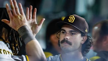 Sep 13, 2025; San Diego, California, USA; San Diego Padres starting pitcher Dylan Cease (84) celebrates in the dugout after coming off the field during the sixth inning against the Colorado Rockies at Petco Park. Mandatory Credit: David Frerker-Imagn Images