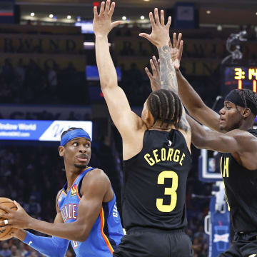 Mar 20, 2024; Oklahoma City, Oklahoma, USA; Utah Jazz guard Keyonte George (3) and forward Taylor Hendricks (0) defends a pass by Oklahoma City Thunder guard Shai Gilgeous-Alexander (2) during the second quarter at Paycom Center. Mandatory Credit: Alonzo Adams-USA TODAY Sports