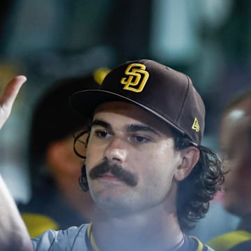 Sep 13, 2025; San Diego, California, USA; San Diego Padres starting pitcher Dylan Cease (84) celebrates in the dugout after coming off the field during the sixth inning against the Colorado Rockies at Petco Park. Mandatory Credit: David Frerker-Imagn Images