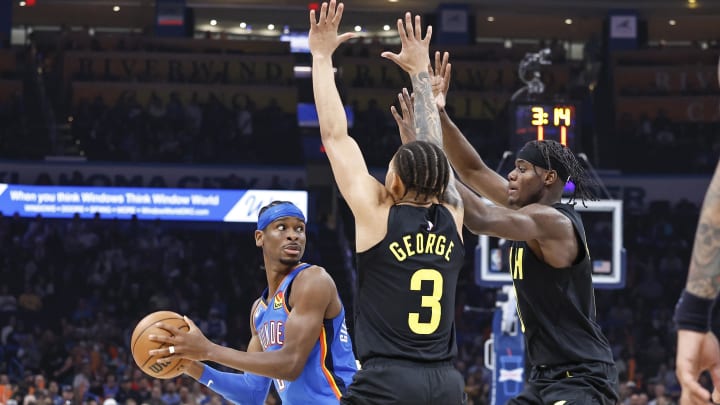 Mar 20, 2024; Oklahoma City, Oklahoma, USA; Utah Jazz guard Keyonte George (3) and forward Taylor Hendricks (0) defends a pass by Oklahoma City Thunder guard Shai Gilgeous-Alexander (2) during the second quarter at Paycom Center. Mandatory Credit: Alonzo Adams-USA TODAY Sports