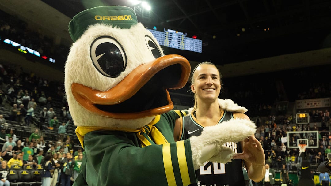 The Oregon Duck and Sabrina Ionescu make an “O” together after the New York Liberty defeated the Toyota Antelopes in a exhibition game at Matthew Knight Arena.