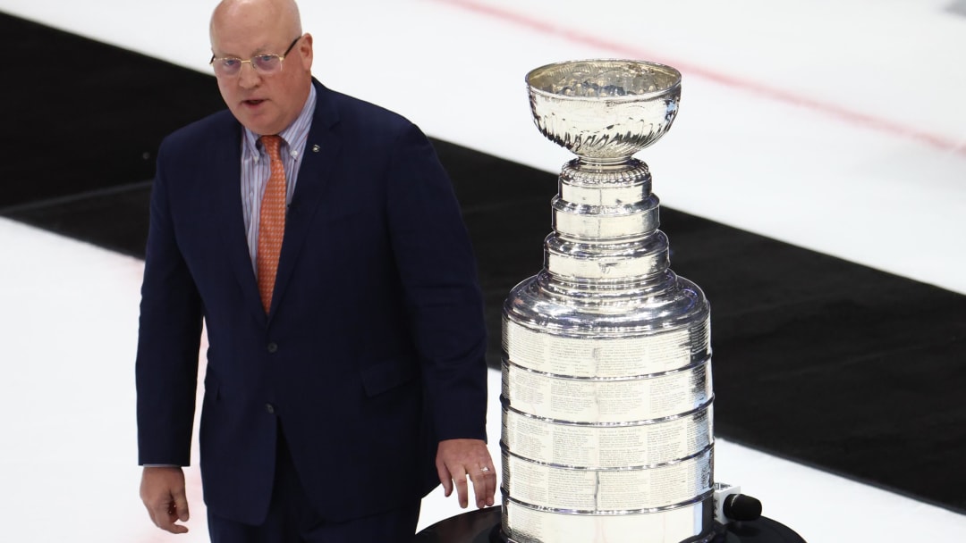 Jun 26, 2022; Tampa, Florida, USA; Deputy NHL Commissioner Bill Daly prepares to present the Colorado Avalanche with the Stanley Cup trophy after defeating the Tampa Bay Lightning during game six of the 2022 Stanley Cup Final at Amalie Arena. Mandatory Credit: Mark J. Rebilas-USA TODAY Sports