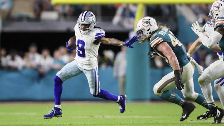 Dec 24, 2023; Miami Gardens, Florida, USA; Dallas Cowboys wide receiver KaVontae Turpin (9) runs with the football against Miami Dolphins linebacker Andrew Van Ginkel (43) during the fourth quarter at Hard Rock Stadium. 