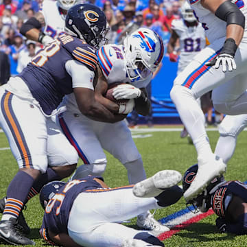 Montez Sweat and Austin Booker make a tackle against the Bills in preseason. Sweat says he is ready to chase QBs and finish with sacks.