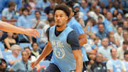 Oct 4, 2025; Charlotte, NC, USA; North Carolina Tar Heels guard Seth Trimble (7) on the fast break as guard Kyan Evans (0) defends in the second half at Dean E. Smith Center. Mandatory Credit: Bob Donnan-Imagn Images