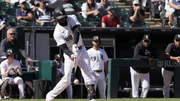 Jun 30, 2024; Chicago, Illinois, USA; Chicago White Sox outfielder Luis Robert Jr. (88) hits a single against the Colorado Rockies during the thirteenth inning at Guaranteed Rate Field. Mandatory Credit: David Banks-USA TODAY Sports