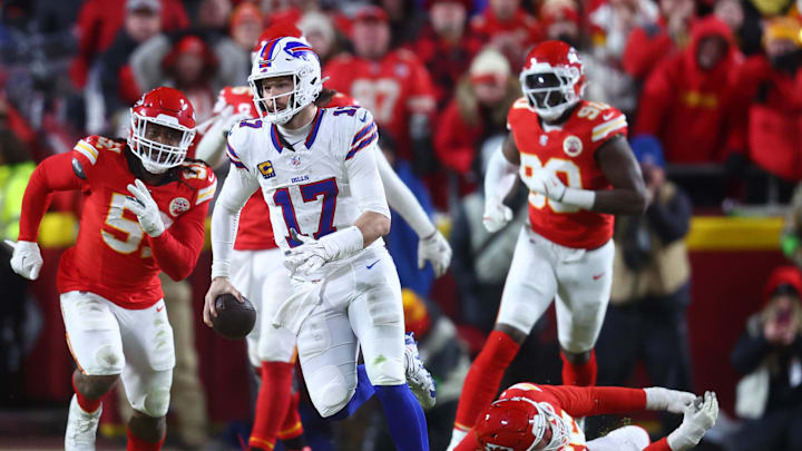 Jan 26, 2025; Kansas City, MO, USA; Buffalo Bills quarterback Josh Allen (17) rushes the ball past Kansas City Chiefs defensive end Mike Danna (51) during the second half in the AFC Championship game at GEHA Field at Arrowhead Stadium. 