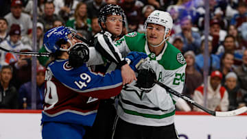 Apr 23, 2025; Denver, Colorado, USA; Linesman CJ Murray (68) separates Colorado Avalanche defenseman Samuel Girard (49) and Dallas Stars center Roope Hintz (24) in the first period in game three of the first round of the 2025 Stanley Cup Playoffs at Ball Arena. Mandatory Credit: Isaiah J. Downing-Imagn Images
